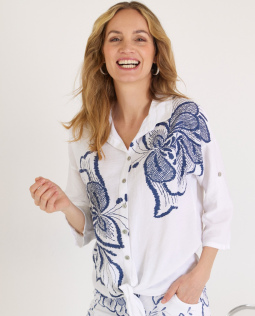 Bluse mit Saumknoten und Blüten